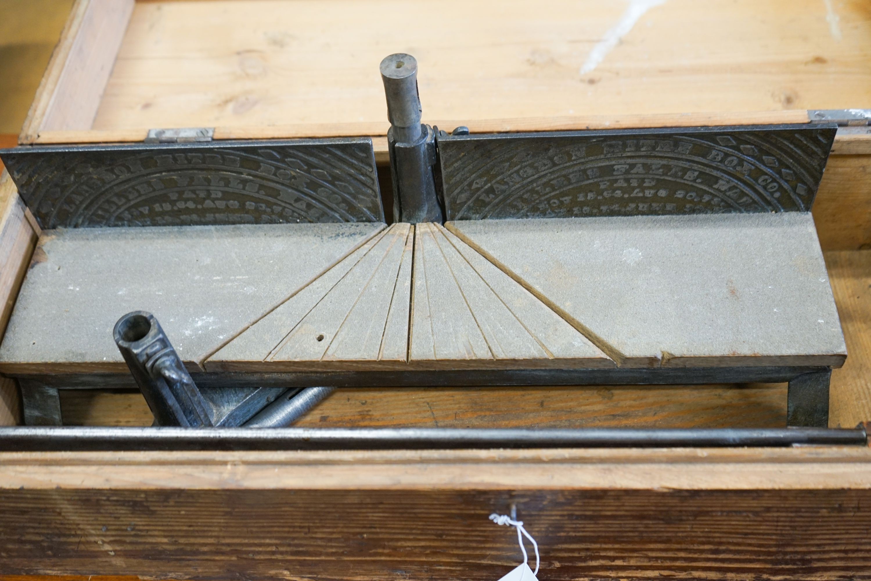 An early 20th century pine cased mitre saw, marked London Mitre Box Company